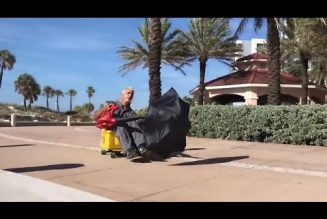 Florida janitor rides his mop bucket, umbrella and leaf blower into well-earned glory…