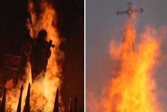 Hooded protestors set fire to two historic Catholic churches in Chile…