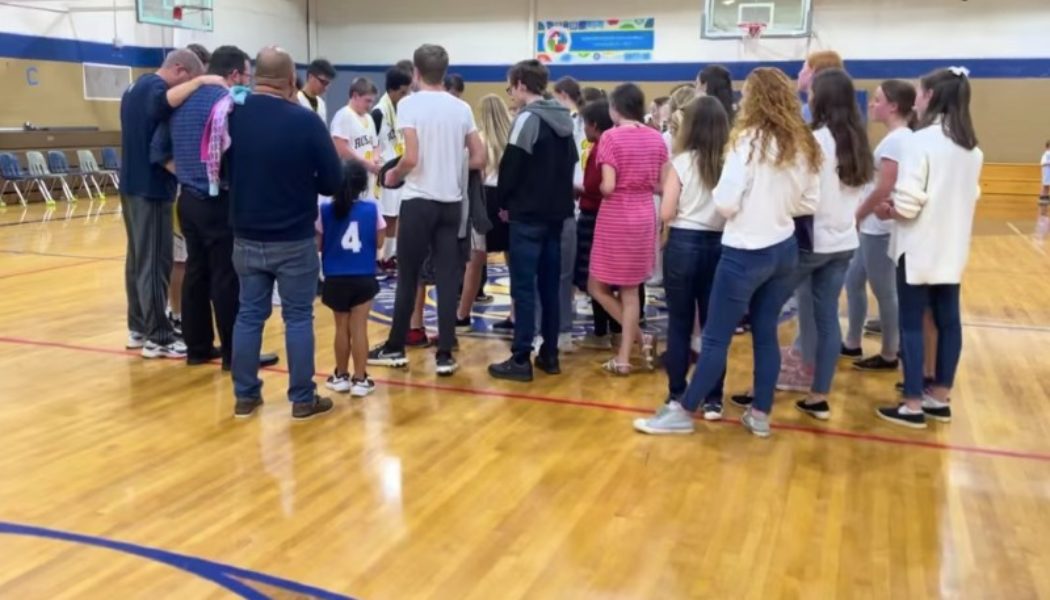 Catholic school kids break out singing the Regina Caeli in gym after first home game victory…