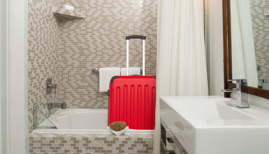Here’s why you should put luggage in your hotel room’s bathtub, according to experts…